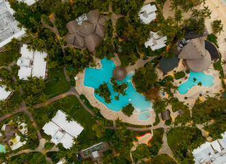 A beautiful tropical resort with a pool and palm trees