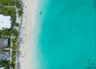 A beautiful blue ocean with a white building in the background