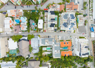 A view of a residential neighborhood with houses and a pool