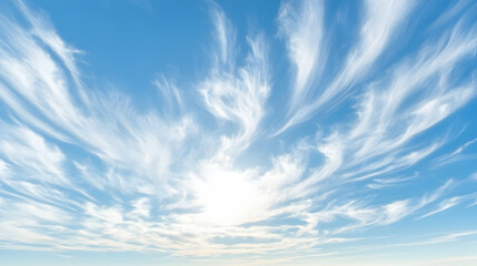 Stunning panoramic view of a vibrant blue sky adorned with delicate, swirling cirrus clouds, creating a breathtaking celestial tapestry.