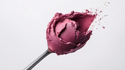 A close-up of a spoon scooping creamy a&ccedil;a&iacute;.