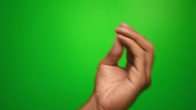male hand showing italian gesture on green screen background