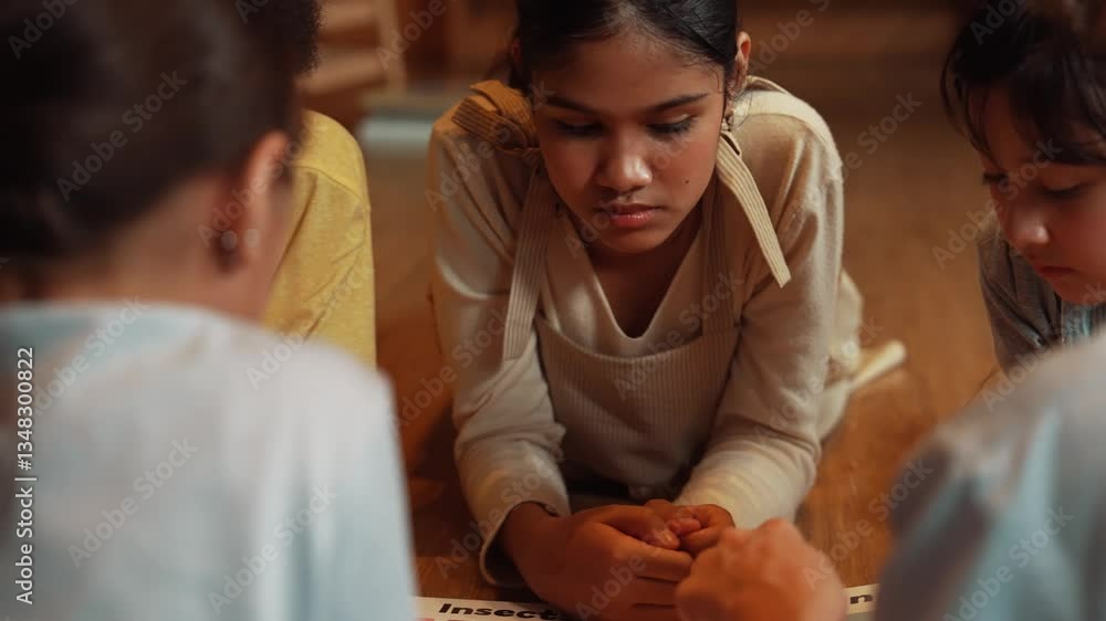 Poster caucasian girl sharing experience while reading a book together with multicultural friend at library