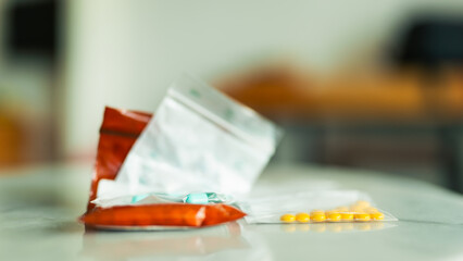 Medicine bag containing capsules and tablets of patient in room concept of people getting medicine for illness nowadays.