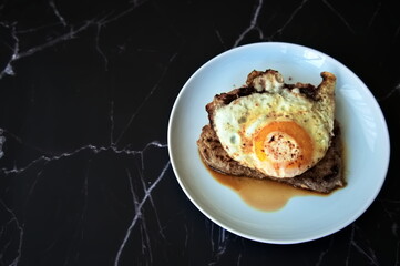 Directly above shot of steak with egg