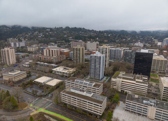 A city view with a lot of buildings and a few cars