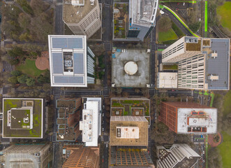 A city view from above with a green path running through it