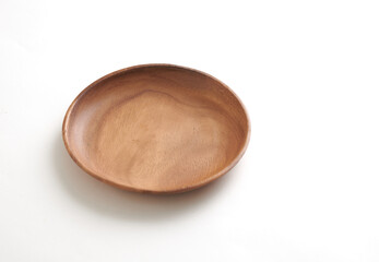 Round Wooden Plate with Smooth Finish on White Background.