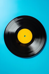Obraz premium Vintage vinyl record isolated on a solid blue background