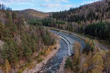 Southern Urals, a railway line near the Inzer River in the area of the Aigir rocks (Aigir rapids). Aerial view.
