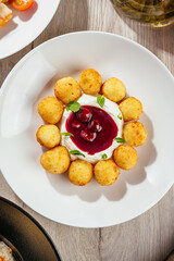 cheesecakes with sour cream and berry sauce