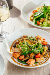 vegetable salad with greens, sesame, shrimp and sauce