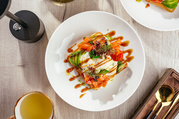 poached egg sandwich with salmon and sauce