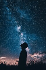 A person gazing up at the night sky, stars twinkling above. The vastness of space mirrors the endless path of personal discovery