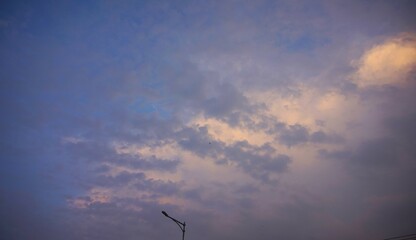 beautiful afternoon sky and yellowing clouds because of the sunlight