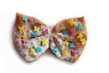 Italian traditional fried Crostoli or chiacchere or Bugie in shape of a bow or butterfly isolated on white background