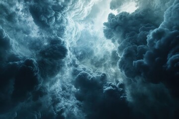 Dramatic swirling clouds illuminated by hidden light create an atmospheric sky during twilight
