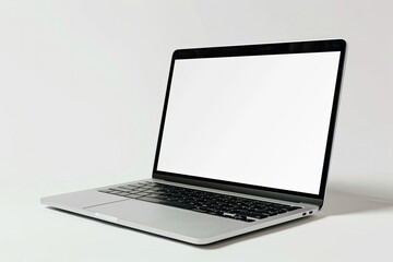 Fototapeta premium Modern Laptop Computer with Blank Screen on Wooden Table Against Bookshelves Filled with Books