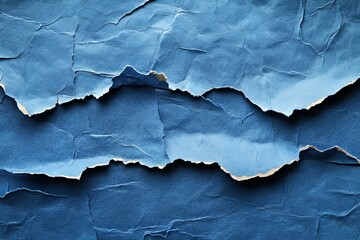 Close up view shows torn blue paper texture background