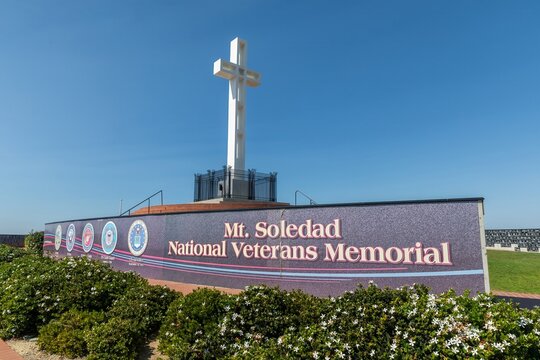 Visitors at Mt. Soledad National Veterans. The memorial honors veterans with a large cross and plaques. Mount Soledad Memorial Park, La Jolla, California, USA. 23 September 2024