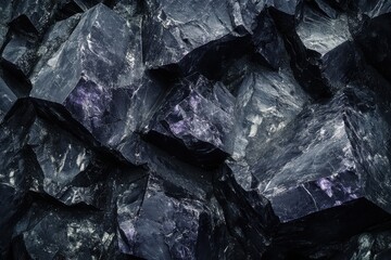 Close-up of dark purple and black crystals in natural light, highlighting their beauty
