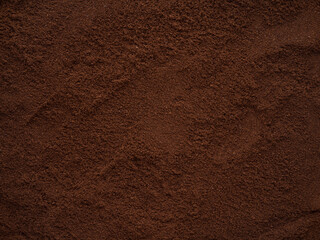 Grounded coffee beans top view background texture