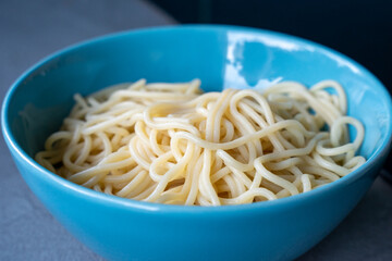 Close-up of cooked spaghetti in blue bowl