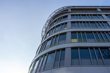 Modern curved office building with glass windows
