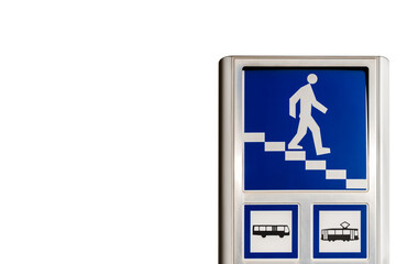 Bue underpass sign with tram and bus transport signs