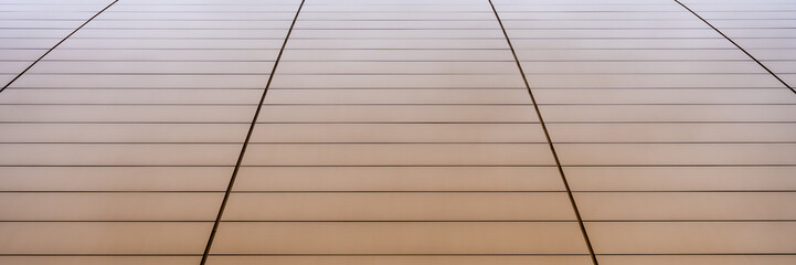 Minimalist gold building facade with geometric patterns