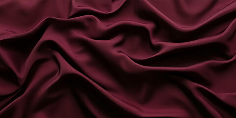 Fototapeta premium A sleek and polished polyester fabric texture background in deep burgundy. The smooth, wrinkle-resistant material has a slight sheen, making it ideal for modern clothing, sportswear, and minimalist