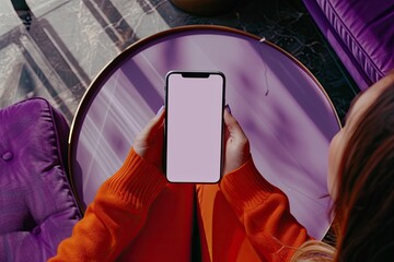 Ultra Quality Picture of Overhead Shot of a Woman Holding Smartphone on Purple Table