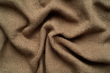 A warm, soft wool tweed fabric texture background in earthy brown tones. The coarse weave with visible flecks creates a timeless, vintage aesthetic perfect for tailored jackets, hats, and autumn decor