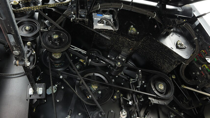 Mechanism and motor components of an agricultural grain harvester in operational condition during...