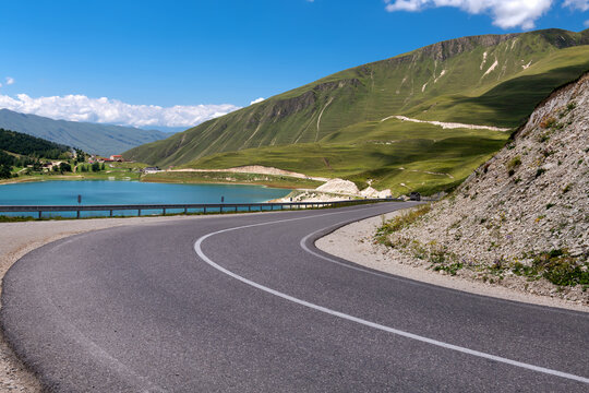 A sharp turn on a mountain road. The serpentine. Car winding road in beautiful mountains. Caucasus. The Chechen Republic, Russia