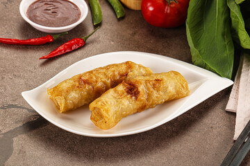 Vietnamese stuffed spring roll served sauce
