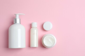 Natural cosmetic products a pink background, top view