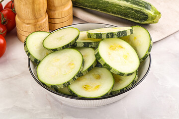 Raw green zucchini slices for cooking