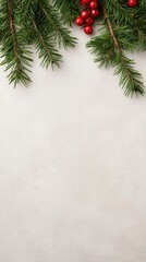 Aesthetic overhead view of evergreen sprigs and vibrant red berries elegantly arranged on a textured light gray background in a vertical format.
