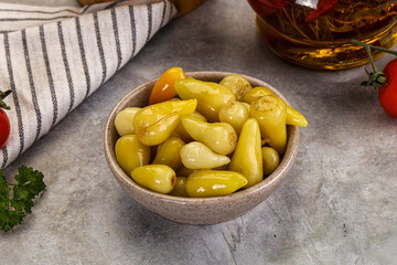 Turkish traditional marinated mini chili peppers