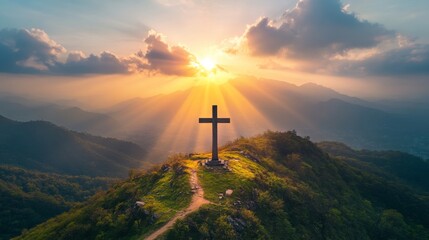 Obraz premium Majestic Cross Silhouette At Sunset Over Mountains