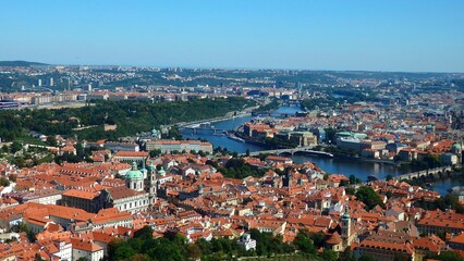 Fototapeta premium View of Charles bridge across Vltava river and the Prague castle complex on a sunny day in Prague, Czech Republic