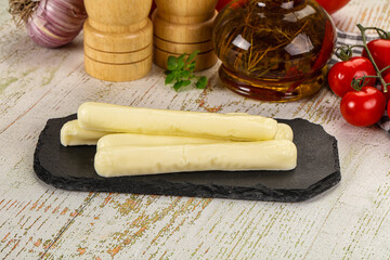 White mozzarella sticks over board