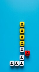 Colorful dice with silhouette icons of people symbolizing team building selection