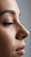 Profile Portrait Exhibiting Flawless Skin and Gentle Facial Features in Soft Lighting