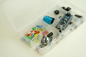Electronics components, Breadboard in box with jumper wires and breadboard, symbolizing DIY...