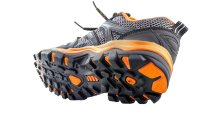 Pair of hiking boots showing soles on transparent background
