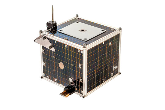 A compact CubeSat satellite with a metallic gold panel. Designed for space exploration and scientific missions