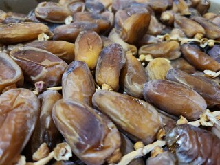 Dried dates in a box. Texture of dates