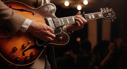 Obraz premium Man playing electric guitar in dimly-lit, rustic setting with audience background